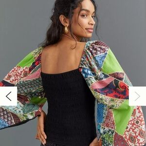 Anthropologie Black Top with Colorful Patchwork Sleeves